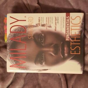 Standard Esthetics Fundamentals Book - White with Red and Orange Accents